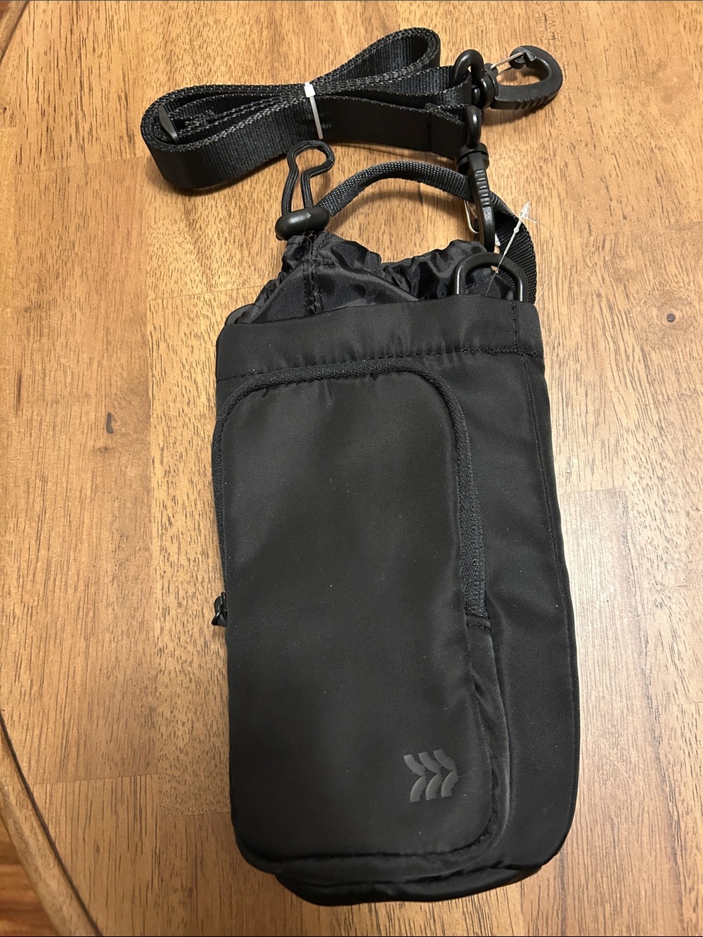 Insulated water bottle and cell phone carrier.